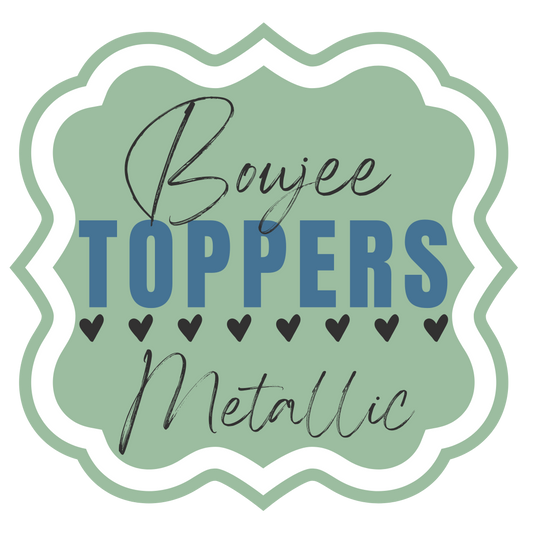 Sage green and white logo for "Boujee Toppers Metallic," featuring a scalloped frame, stylized text, and a row of black hearts. 

